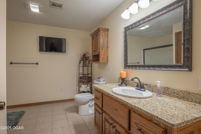 2402 Melissa Ln, Joplin, MO 64804 - bathroom with vanity, toilet, tile patterned floors, and baseboards