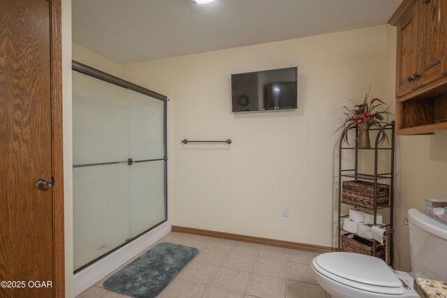 2402 Melissa Ln, Joplin, MO 64804 - full bathroom with a stall shower, toilet, baseboards, and tile patterned floors