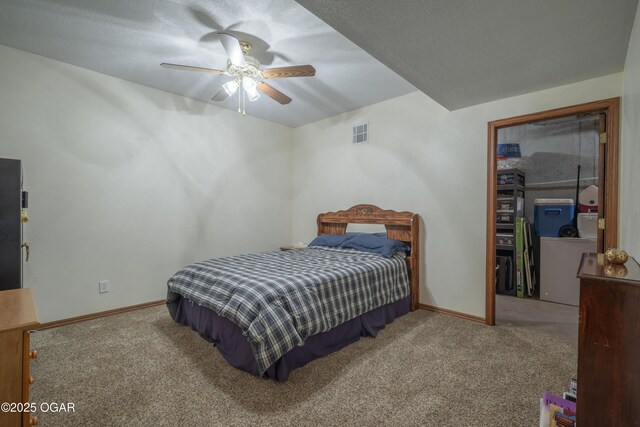 2402 Melissa Ln, Joplin, MO 64804 - bedroom featuring carpet floors, a spacious closet, baseboards, and ceiling fan