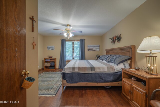 2402 Melissa Ln, Joplin, MO 64804 - bedroom with dark wood-style floors and a ceiling fan