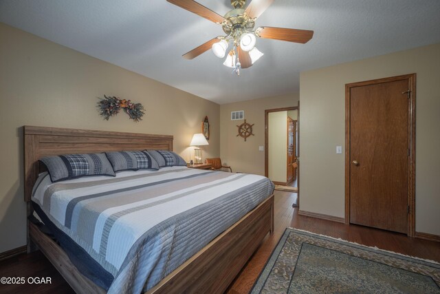 2402 Melissa Ln, Joplin, MO 64804 - bedroom featuring wood finished floors, ceiling fan, and baseboards