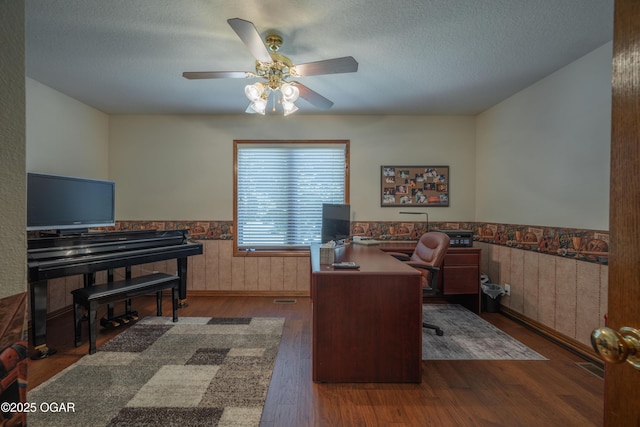 2402 Melissa Ln, Joplin, MO 64804 - office space featuring a wainscoted wall, a ceiling fan, wood finished floors, and a textured ceiling