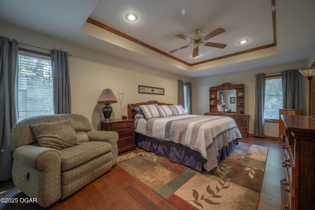 2402 Melissa Ln, Joplin, MO 64804 - bedroom with a raised ceiling, wood finished floors, crown molding, recessed lighting, and a ceiling fan
