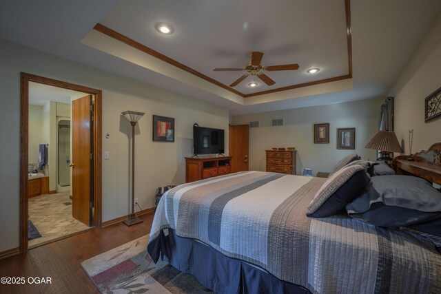 2402 Melissa Ln, Joplin, MO 64804 - bedroom featuring a raised ceiling, wood finished floors, recessed lighting, and baseboards