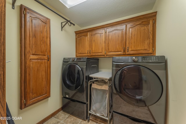 2402 Melissa Ln, Joplin, MO 64804 - laundry area with washing machine and dryer, cabinet space, and a textured ceiling