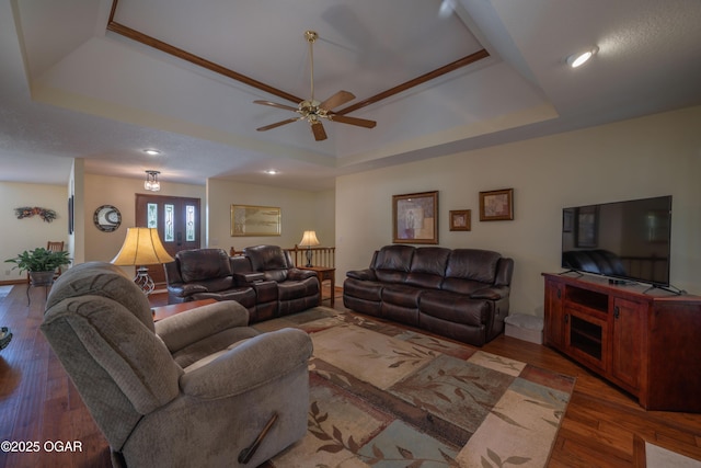 2402 Melissa Ln, Joplin, MO 64804 - living room with a tray ceiling, wood finished floors, a ceiling fan, recessed lighting, and baseboards