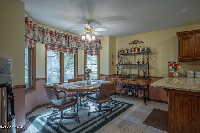 2402 Melissa Ln, Joplin, MO 64804 - dining area with a ceiling fan and light tile patterned floors
