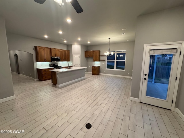 305 Ashmore Dr, Carl Junction, MO 64834 - kitchen featuring stainless steel appliances, ceiling fan, baseboards, and recessed lighting