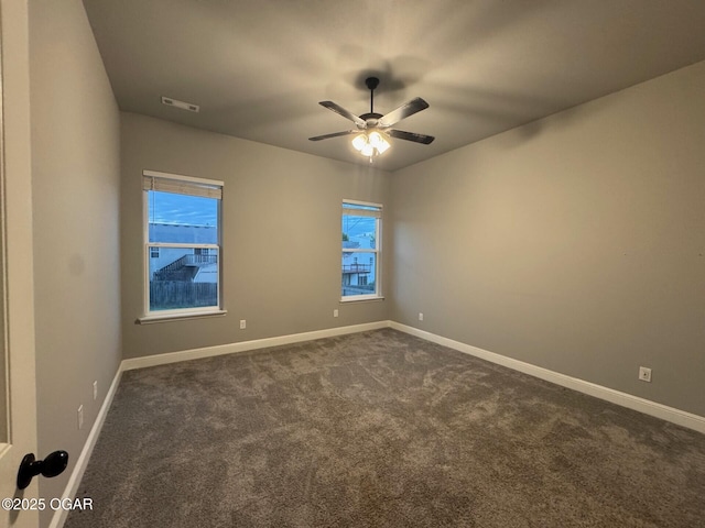 305 Ashmore Dr, Carl Junction, MO 64834 - unfurnished room with dark colored carpet, baseboards, and ceiling fan