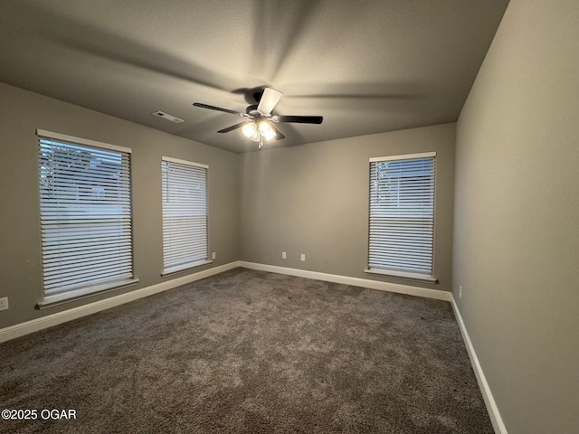 305 Ashmore Dr, Carl Junction, MO 64834 - spare room featuring dark carpet, baseboards, and a ceiling fan