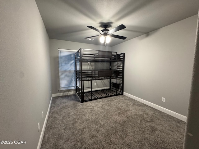 305 Ashmore Dr, Carl Junction, MO 64834 - unfurnished bedroom with carpet flooring, baseboards, and a ceiling fan