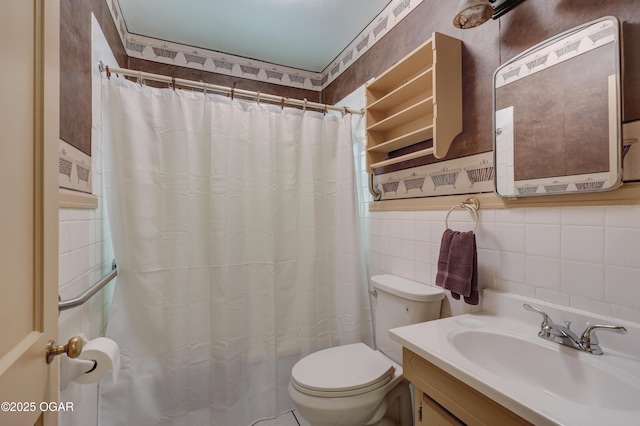 430 N Jackson Ave, Joplin, MO 64801 - bathroom with tile walls, toilet, vanity, and a shower with shower curtain