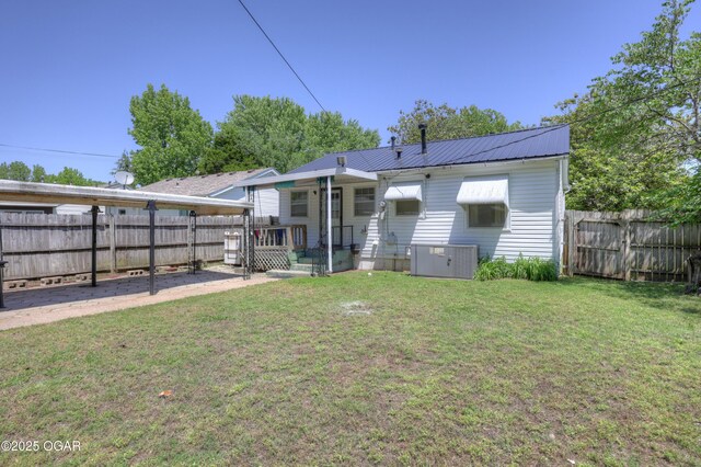430 N Jackson Ave, Joplin, MO 64801 - rear view of property featuring central AC unit and metal roof