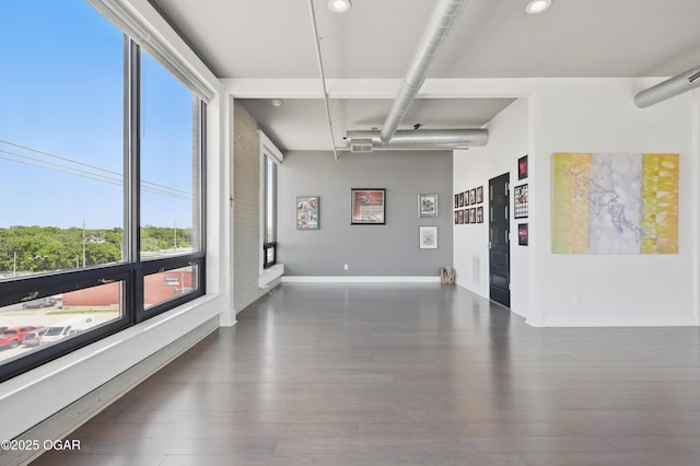 214 E 4th St Unit 402, Joplin, MO 64801 - empty room with wood finished floors, recessed lighting, and baseboards