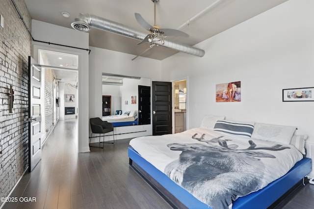 214 E 4th St Unit 402, Joplin, MO 64801 - bedroom featuring wood finished floors and ceiling fan