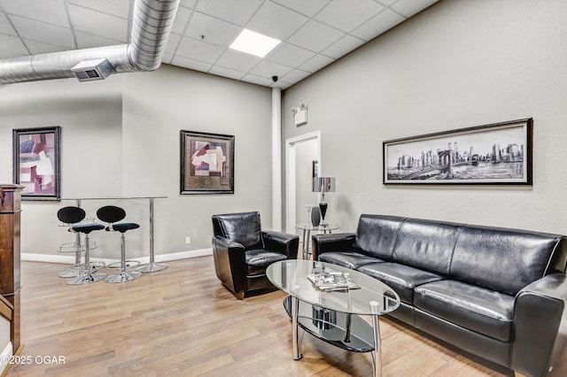 214 E 4th St Unit 402, Joplin, MO 64801 - living area featuring wood finished floors, baseboards, and a drop ceiling