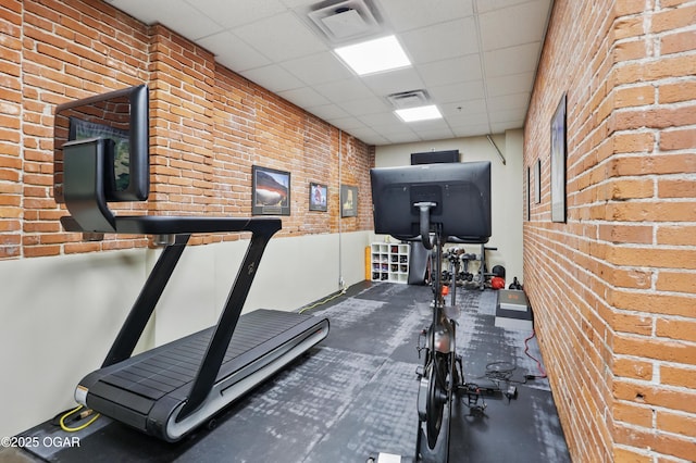 214 E 4th St Unit 402, Joplin, MO 64801 - workout area with brick wall and a paneled ceiling