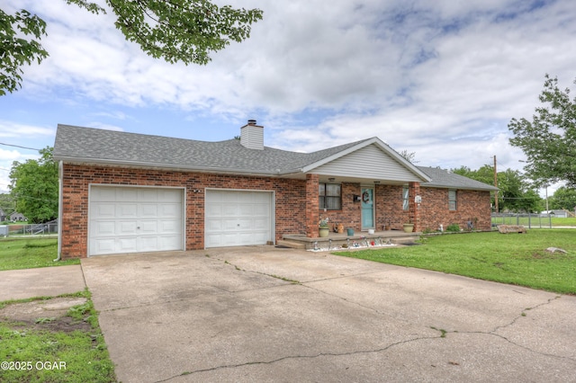 610 N Madison St, Webb City, MO 64870 - ranch-style house with brick siding, covered porch, an attached garage, and concrete driveway
