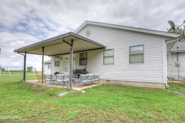 610 N Madison St, Webb City, MO 64870 - back of property featuring a yard, a patio area, and an outdoor hangout area
