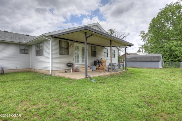 610 N Madison St, Webb City, MO 64870 - back of house featuring french doors, a yard, and a patio area