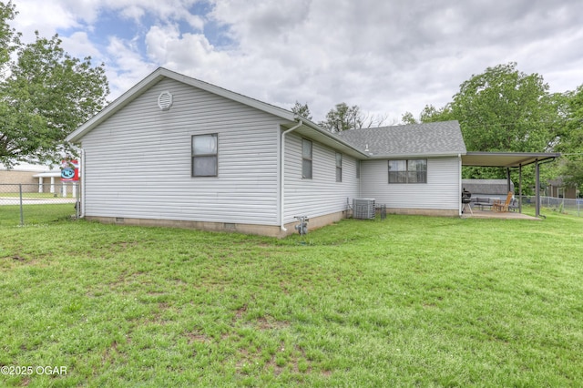 610 N Madison St, Webb City, MO 64870 - rear view of house featuring central AC unit, a patio, and roof with shingles