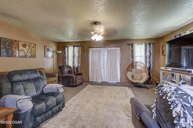 610 N Madison St, Webb City, MO 64870 - carpeted living area featuring a textured ceiling and ceiling fan