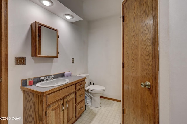 610 N Madison St, Webb City, MO 64870 - half bathroom featuring tile patterned floors, vanity, and toilet