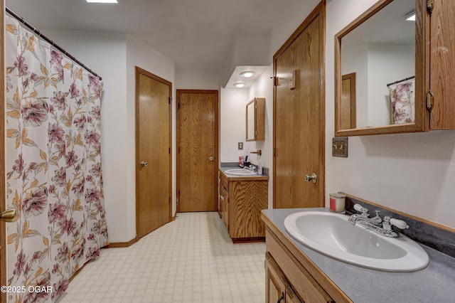 610 N Madison St, Webb City, MO 64870 - full bathroom featuring two vanities, tile patterned floors, and curtained shower