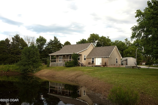 411 N Main St, Diamond, MO 64840 - view of front of property featuring a front yard and a water view