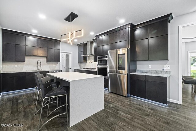 3802 Fawn Trl, Joplin, MO 64804 - kitchen with appliances with stainless steel finishes, a sink, light countertops, backsplash, and recessed lighting