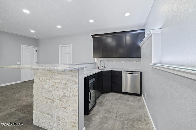 3802 Fawn Trl, Joplin, MO 64804 - bar area featuring dishwasher, beverage cooler, backsplash, recessed lighting, and baseboards
