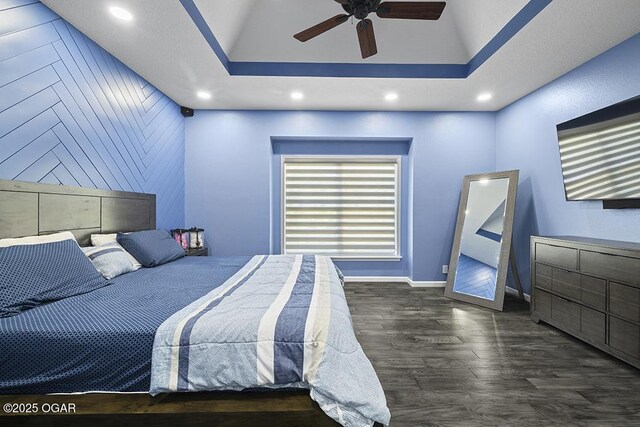 3802 Fawn Trl, Joplin, MO 64804 - bedroom featuring baseboards, wood finished floors, a tray ceiling, recessed lighting, and a ceiling fan
