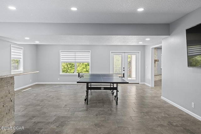 3802 Fawn Trl, Joplin, MO 64804 - game room featuring french doors, plenty of natural light, recessed lighting, baseboards, and a textured ceiling