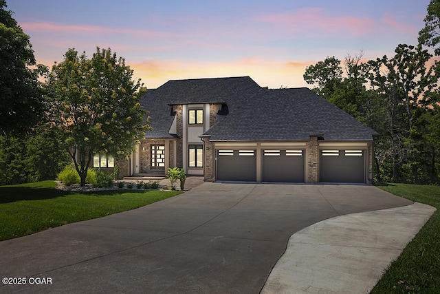 3802 Fawn Trl, Joplin, MO 64804 - view of front facade featuring concrete driveway, a front lawn, an attached garage, and roof with shingles