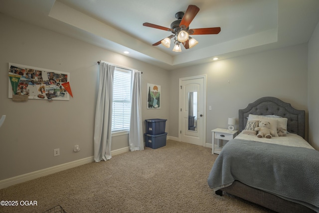 20951 Jasmine Ln, Webb City, MO 64870 - bedroom featuring a tray ceiling, baseboards, light carpet, recessed lighting, and ceiling fan
