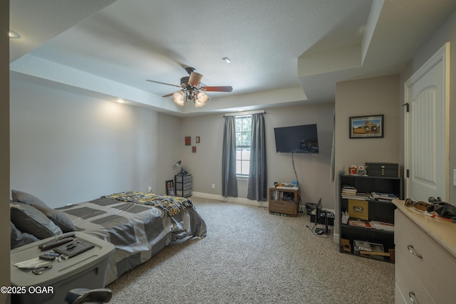 20951 Jasmine Ln, Webb City, MO 64870 - bedroom with a raised ceiling, light carpet, baseboards, and a ceiling fan