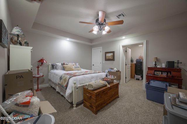 20951 Jasmine Ln, Webb City, MO 64870 - bedroom with light colored carpet, a tray ceiling, recessed lighting, and a ceiling fan