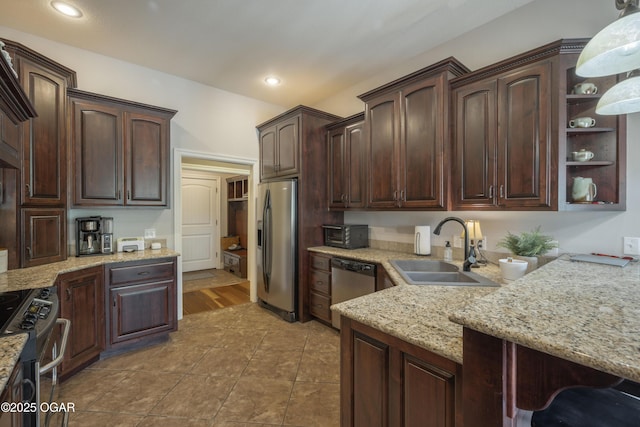 20951 Jasmine Ln, Webb City, MO 64870 - kitchen with appliances with stainless steel finishes, a sink, dark brown cabinets, light stone counters, and recessed lighting