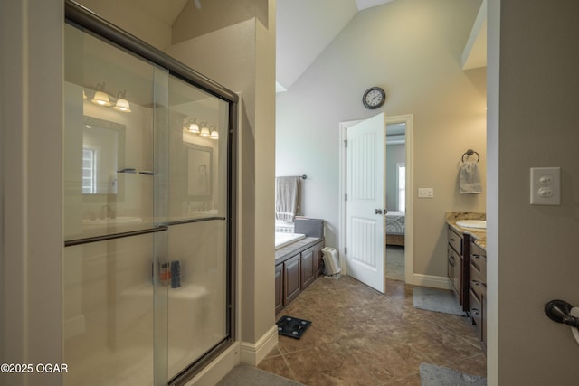20951 Jasmine Ln, Webb City, MO 64870 - full bathroom with vaulted ceiling, vanity, a shower stall, ensuite bath, and baseboards