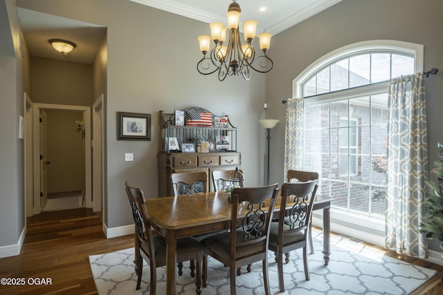 20951 Jasmine Ln, Webb City, MO 64870 - dining space with wood finished floors, a chandelier, ornamental molding, and baseboards