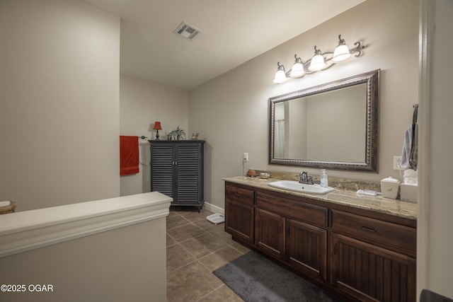 20951 Jasmine Ln, Webb City, MO 64870 - bathroom with vanity, tile patterned flooring, and baseboards