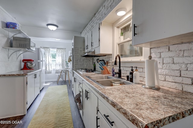 514 S Brownell Ave, Joplin, MO 64801 - kitchen featuring white appliances, a sink, open shelves, white cabinetry, and ornamental molding