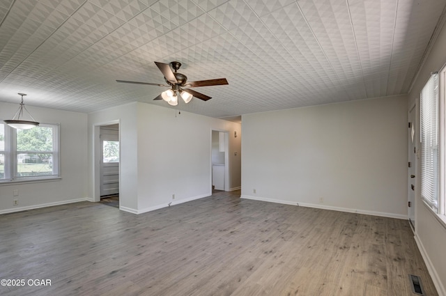 3124 Missouri Ave, Joplin, MO 64804 - spare room with ceiling fan, wood finished floors, and baseboards