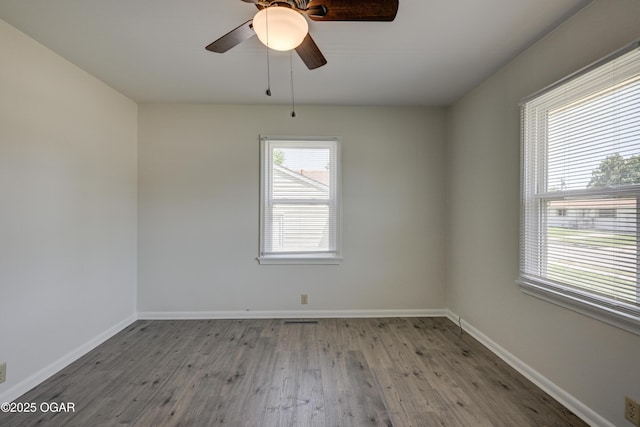 3124 Missouri Ave, Joplin, MO 64804 - unfurnished room with wood finished floors, baseboards, and a ceiling fan