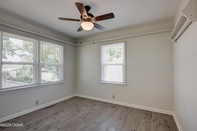 3124 Missouri Ave, Joplin, MO 64804 - unfurnished room with baseboards, wood finished floors, and a ceiling fan
