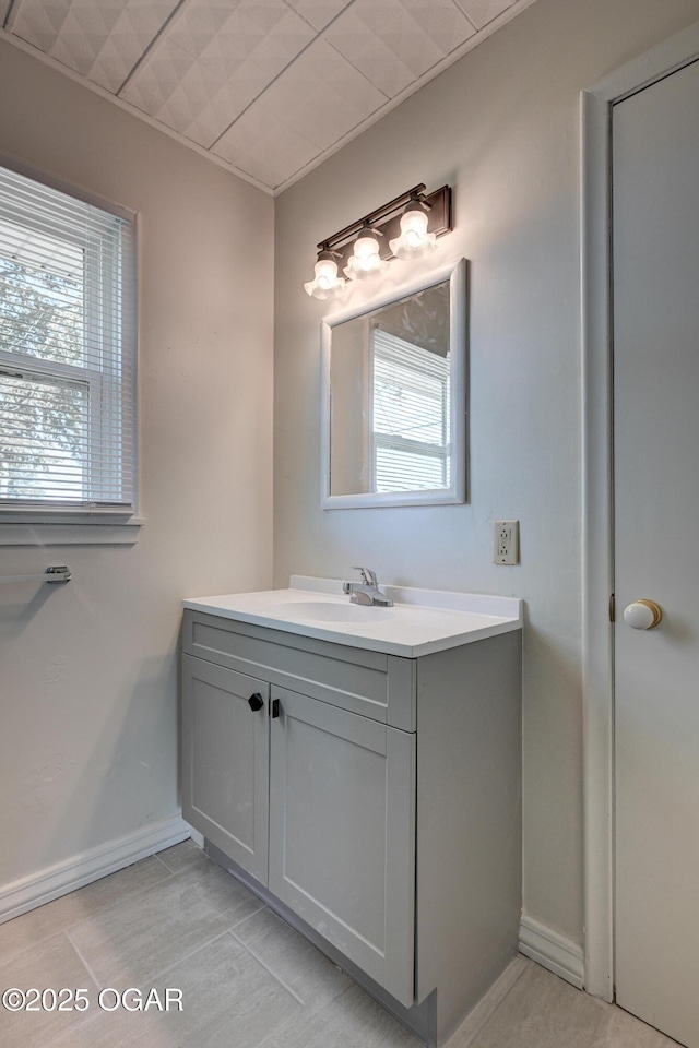 3124 Missouri Ave, Joplin, MO 64804 - bathroom featuring healthy amount of natural light, vanity, and baseboards