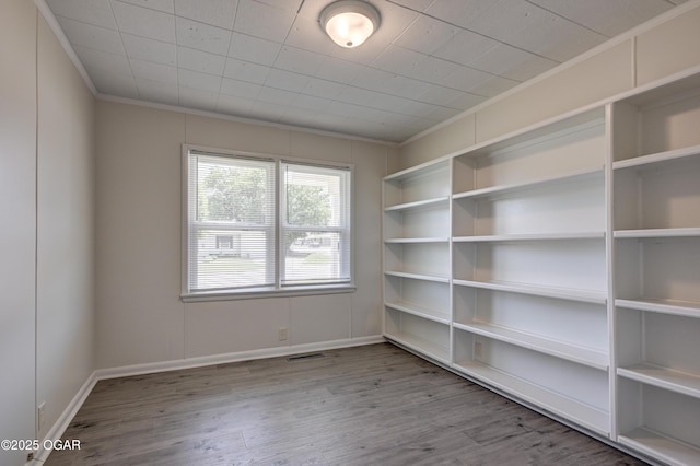 3124 Missouri Ave, Joplin, MO 64804 - empty room with ornamental molding, wood finished floors, and baseboards