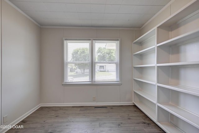 3124 Missouri Ave, Joplin, MO 64804 - spare room with wood finished floors, crown molding, and baseboards