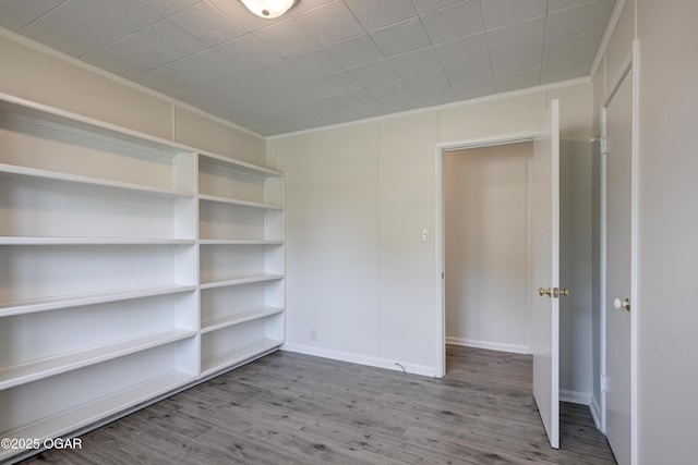 3124 Missouri Ave, Joplin, MO 64804 - empty room with ornamental molding, wood finished floors, and baseboards