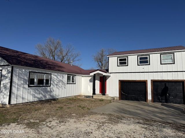 2344 US Highway 60, Pierce City, MO 65723 - modern inspired farmhouse featuring concrete driveway, metal roof, and a garage